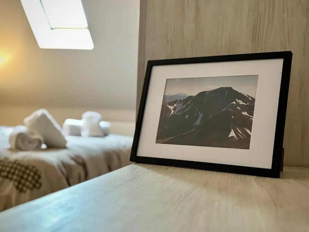 a picture of a mountain in a hotel room at Stunning Speyside retreat, ideal for Whisky lovers in Rothes