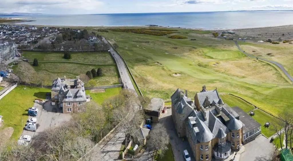 an aerial view of a castle near the ocean at Royal Gardens Apartment 5 in Dornoch