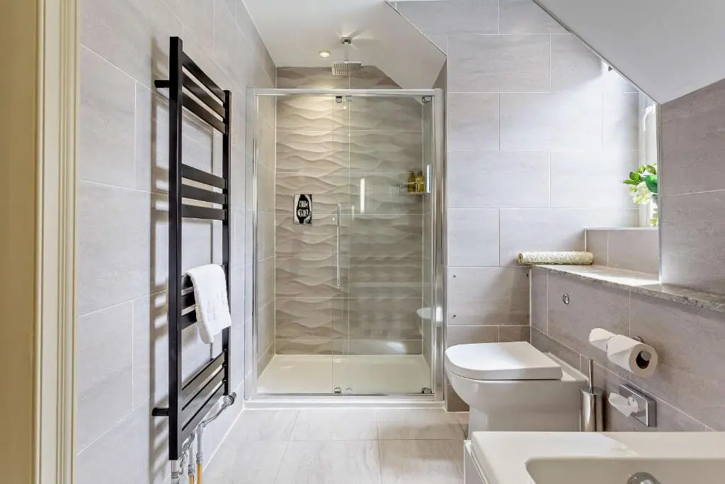 a bathroom with a shower and a toilet and a sink at Muckrach Country House in Skye of Curr