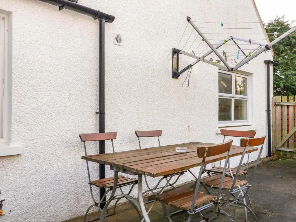 a table and chairs outside of a house at 78 Findhorn in Forres