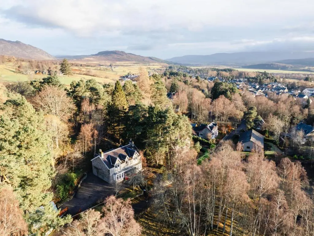 an aerial view of a house in the woods at Villa Netherwood by Interhome in Newtonmore
