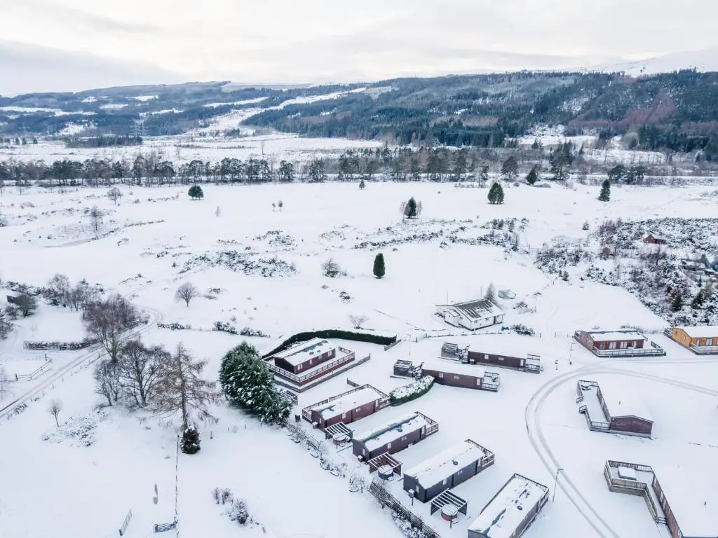 an aerial view of a parking lot covered in snow at Holiday Home ScottishHighlands-LochNess by Interhome in Fort Augustus