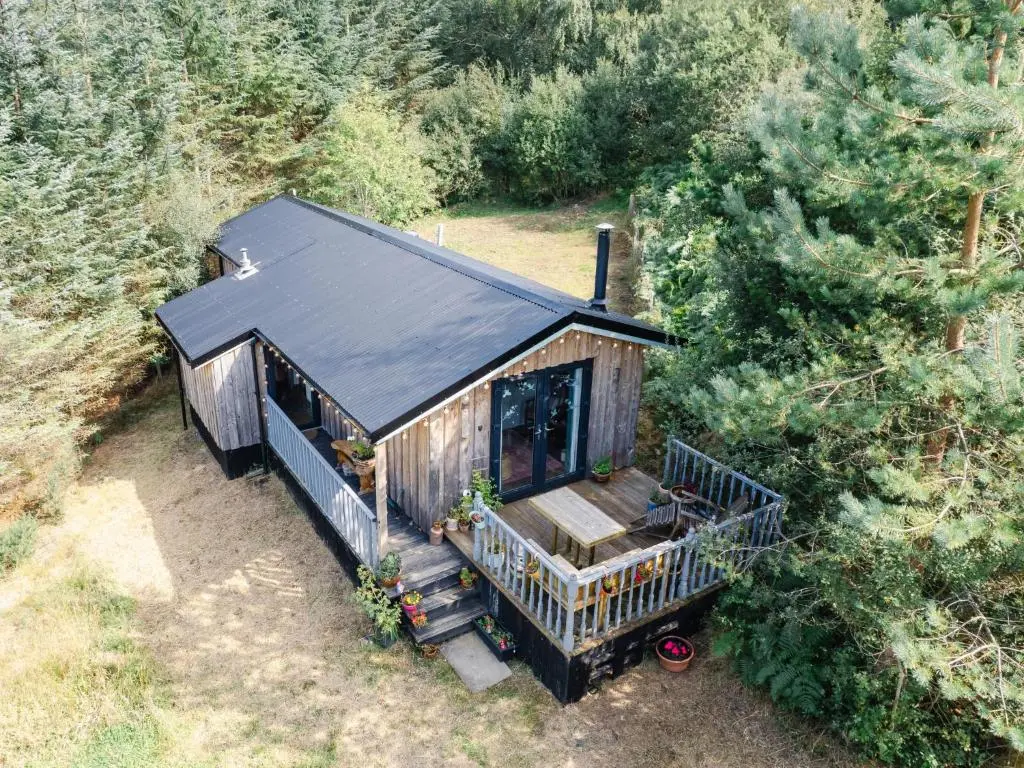 an overhead view of a tiny house in the woods at Chalet The Cabin by Interhome in Eskadale
