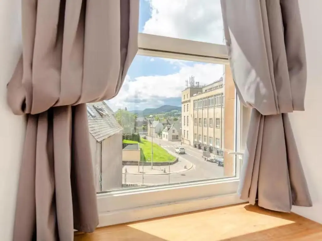 a window with a view of a street at Family - Central - Wifi - Parking - Sleeps 4 in Inverness
