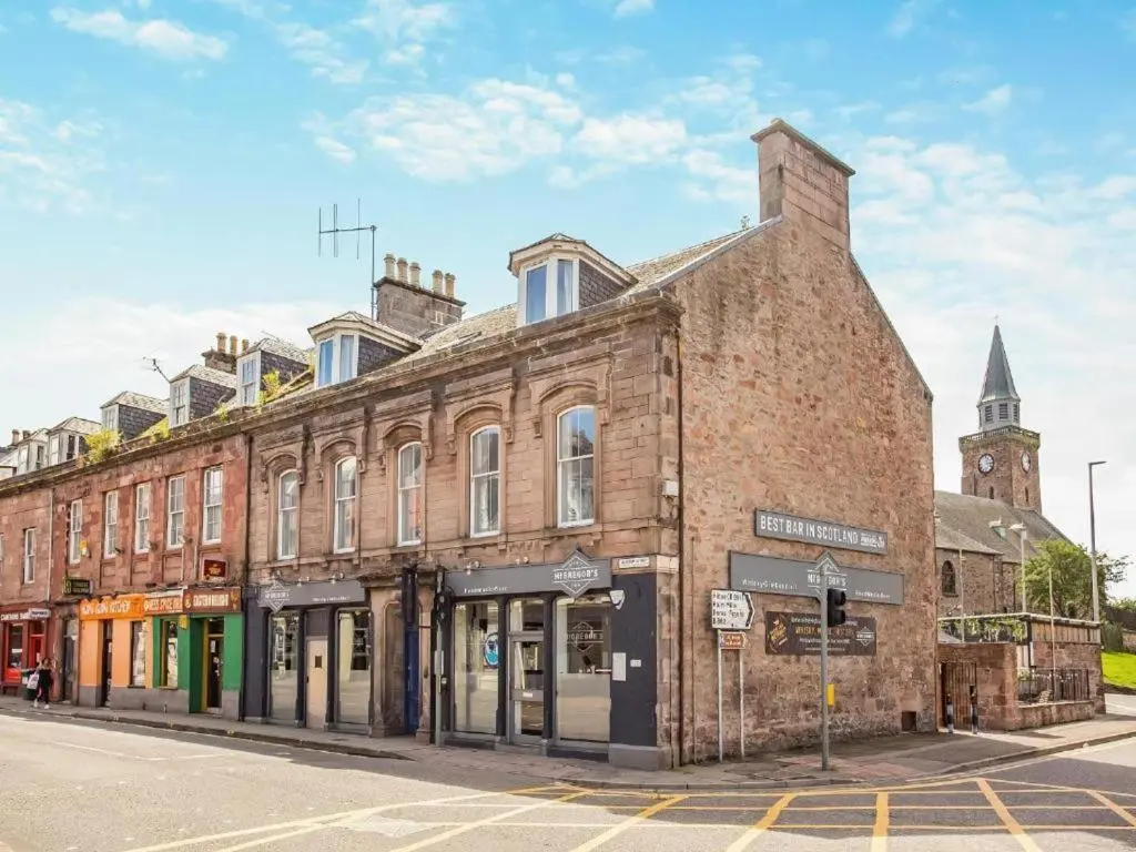 an old brick building on the corner of a street at Family - Central - Parking - Wifi - Sleeps 3 in Inverness