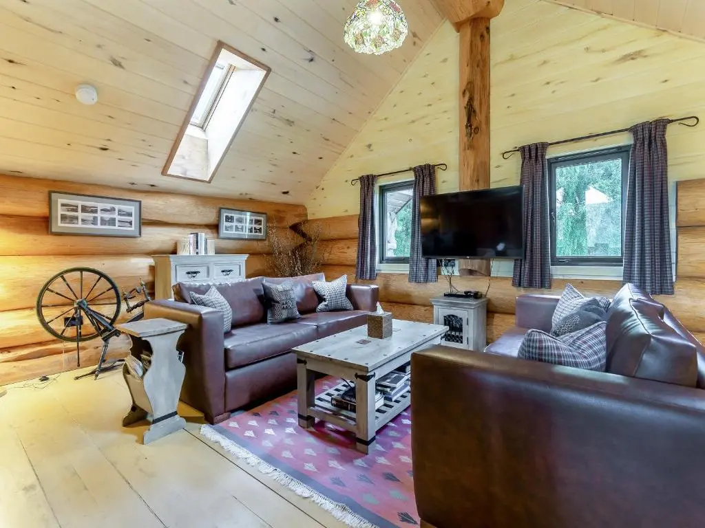 a living room with a couch and a tv at Sylvia - Uk50065 in Struy