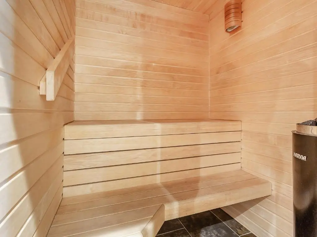 a wooden sauna with a bench in the corner at Cinclus - Uk50066 in Struy