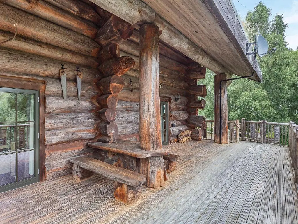a wooden porch of a log cabin at Cinclus - Uk50066 in Struy