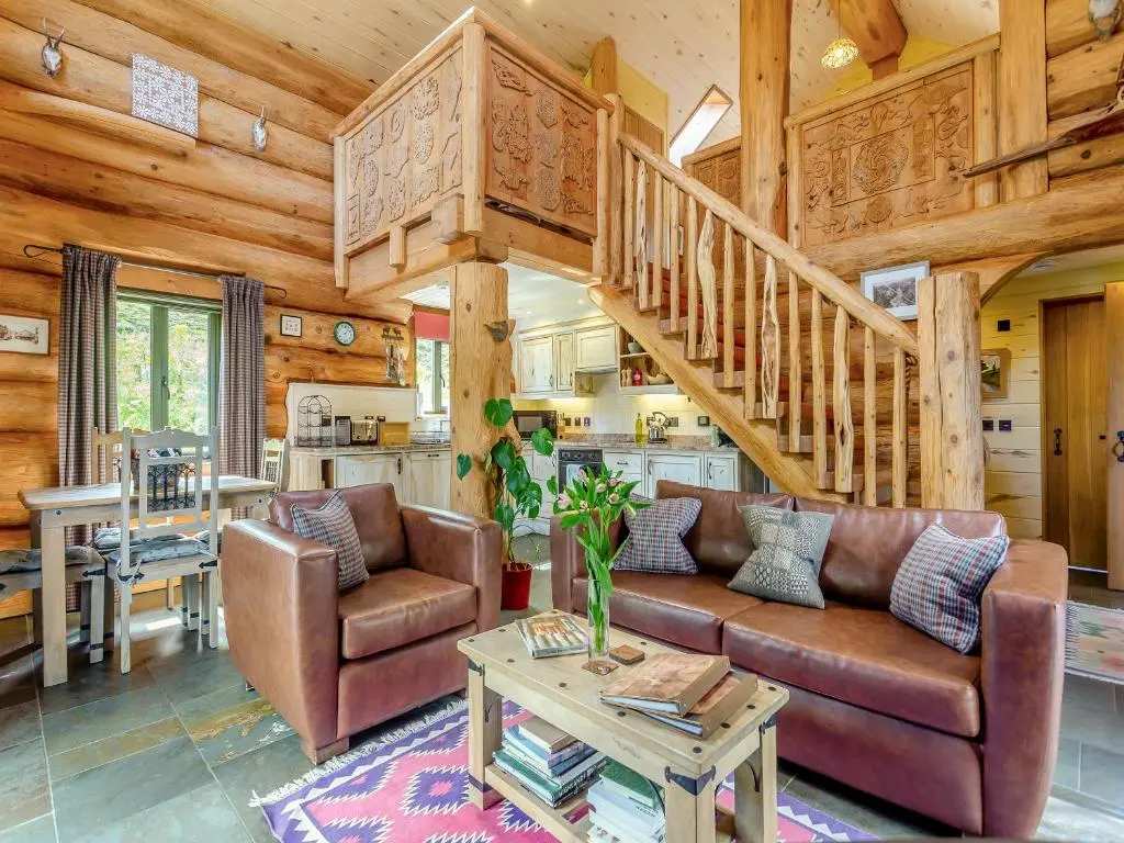 a living room with a couch and a staircase at Strix - Uk50082 in Struy