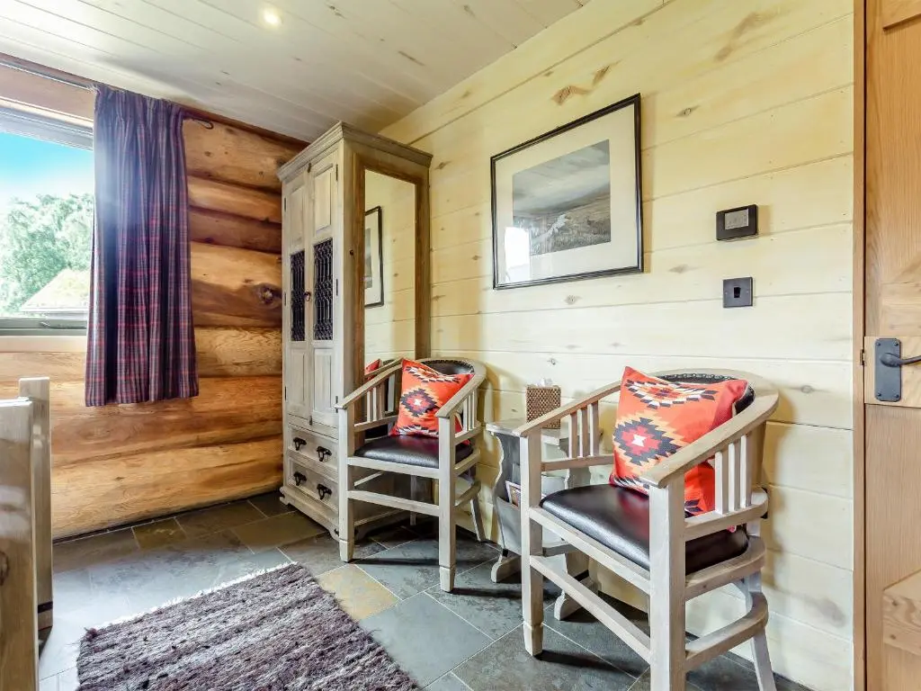 two chairs in a room with wooden walls at Buteo - Uk50068 in Struy