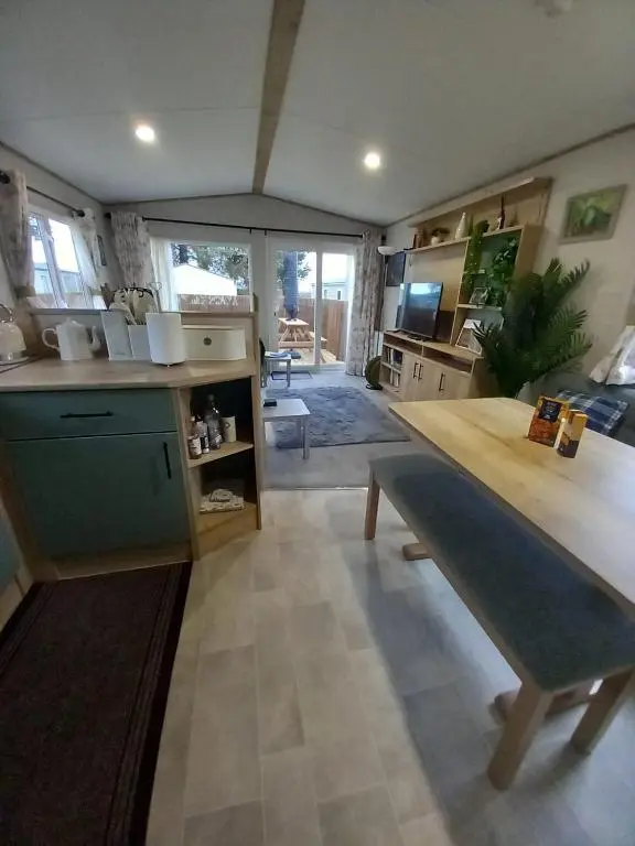 a kitchen with a large table in a room at Boat 32 in Boat of Garten