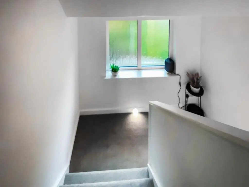 a staircase in a white room with a window at Uppermill Farm in Tarves