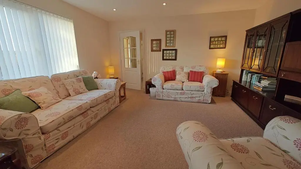 a living room with a couch and two chairs at 3 Bed in Drybridge oc-w34891