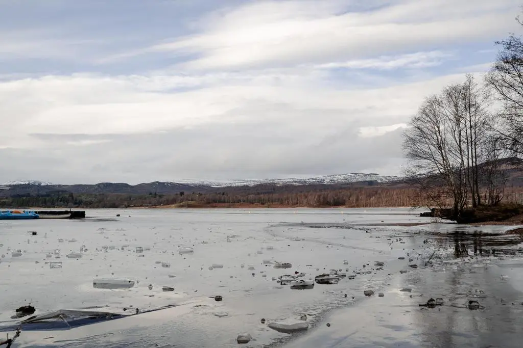 a large body of water with snow on it at Inshlea - Seasgair Lodges in Insh