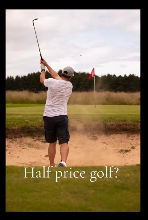 a man swinging a golf club on a golf course at Calder House, Fochabers in Fochabers