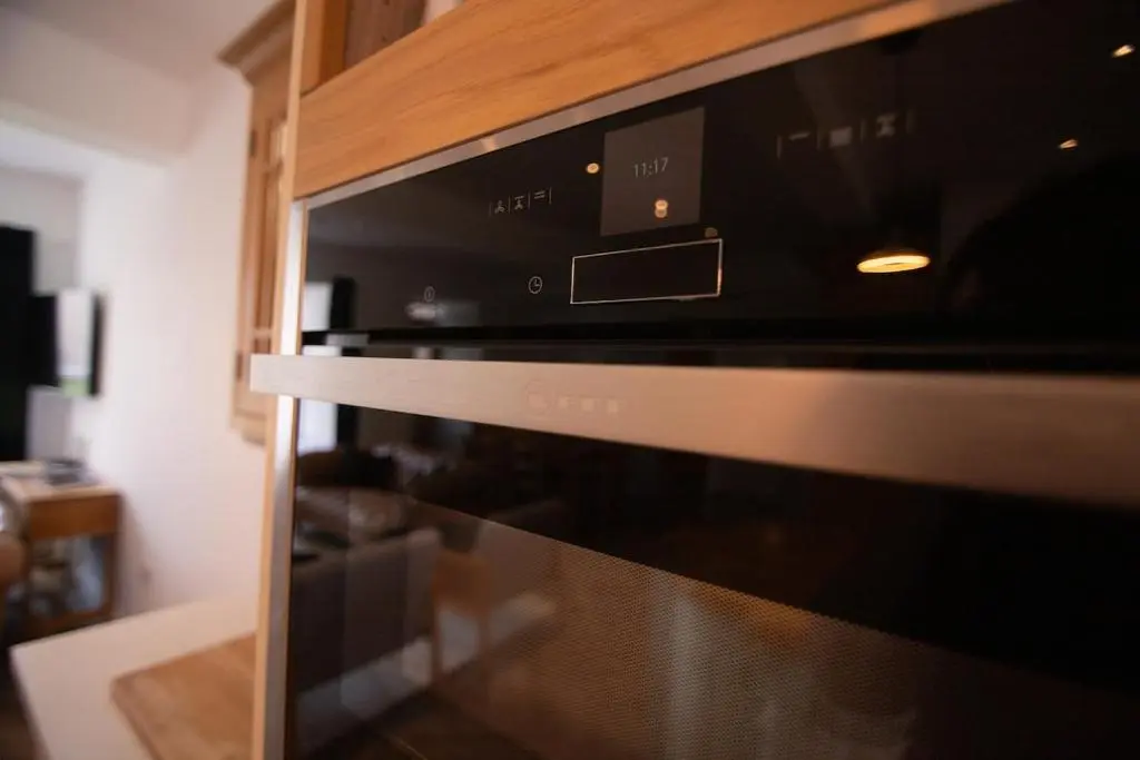a microwave oven sitting inside of a kitchen at Calder House, Fochabers in Fochabers