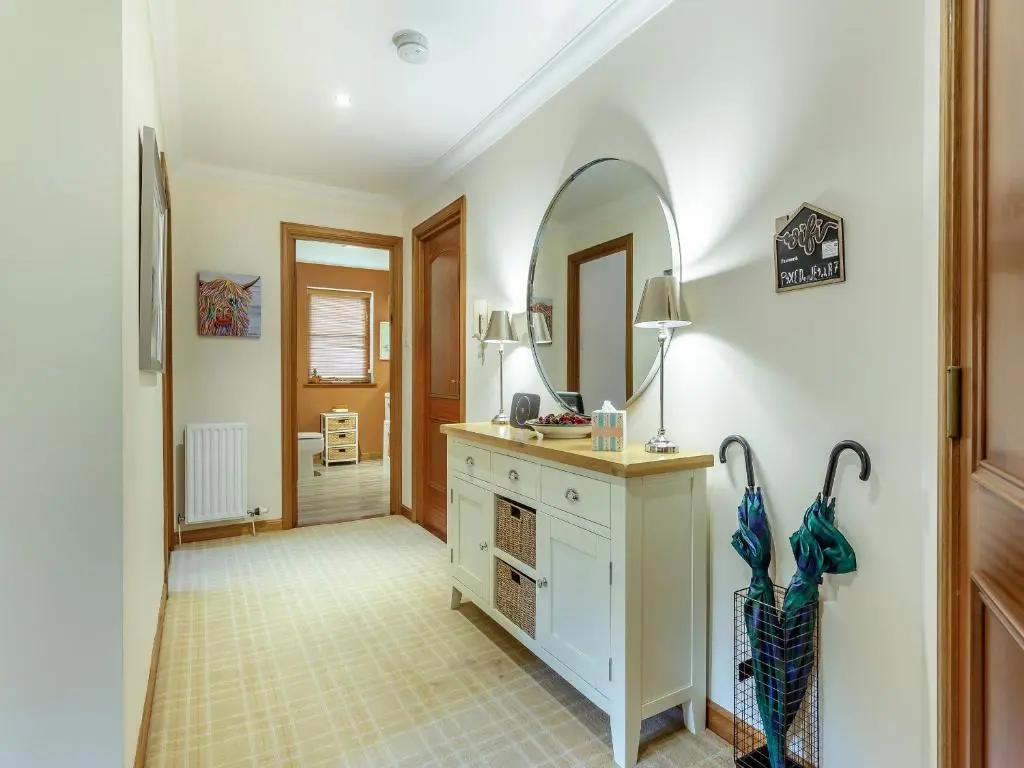 a bathroom with a sink and a mirror at Cosy Ness in Inverness