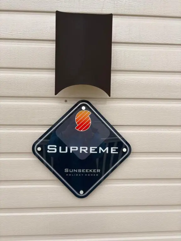 a sign on the side of a building at Sunset villa in Lossiemouth