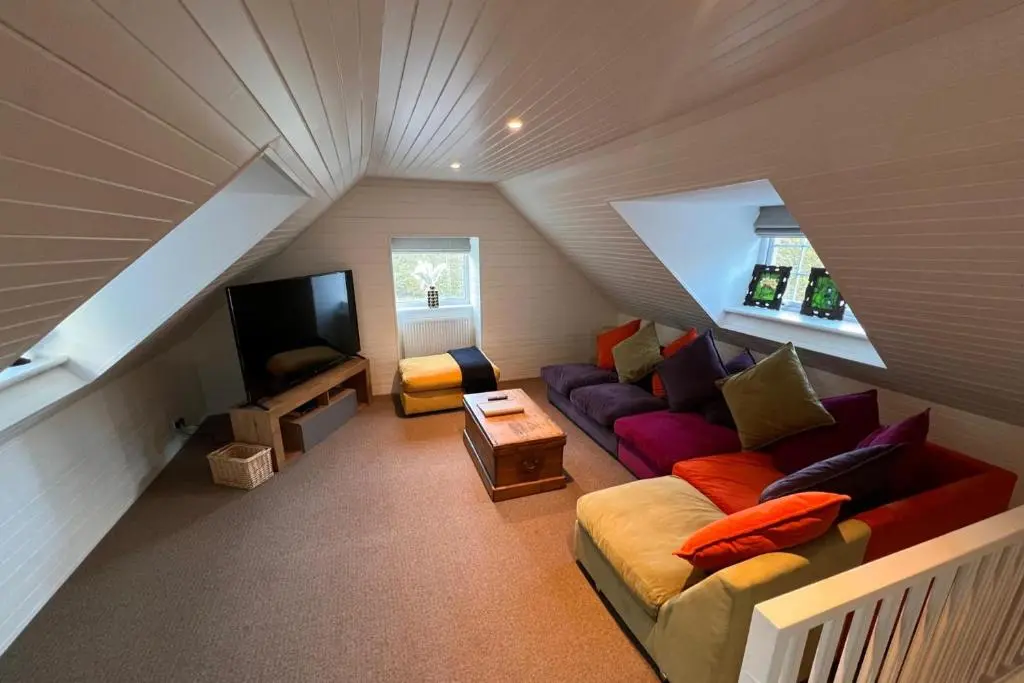 a living room with a couch and a tv at Pets - Garden - Parking - Sleeps 2 - Hiking in Banchory
