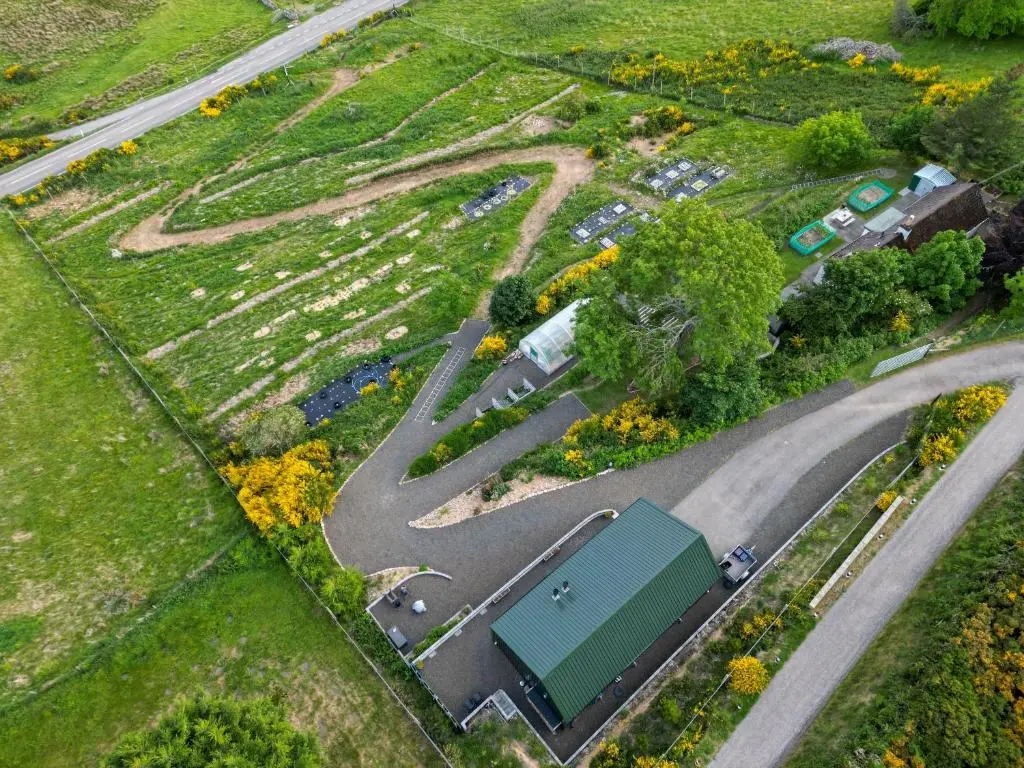 an overhead view of a winding road in a park at Lothmore Lookout - Sunset in Kilmote