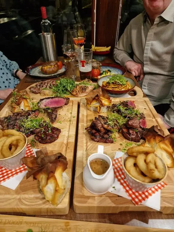 a table with a bunch of food on it at Seafield Arms Hotel in Whitehills