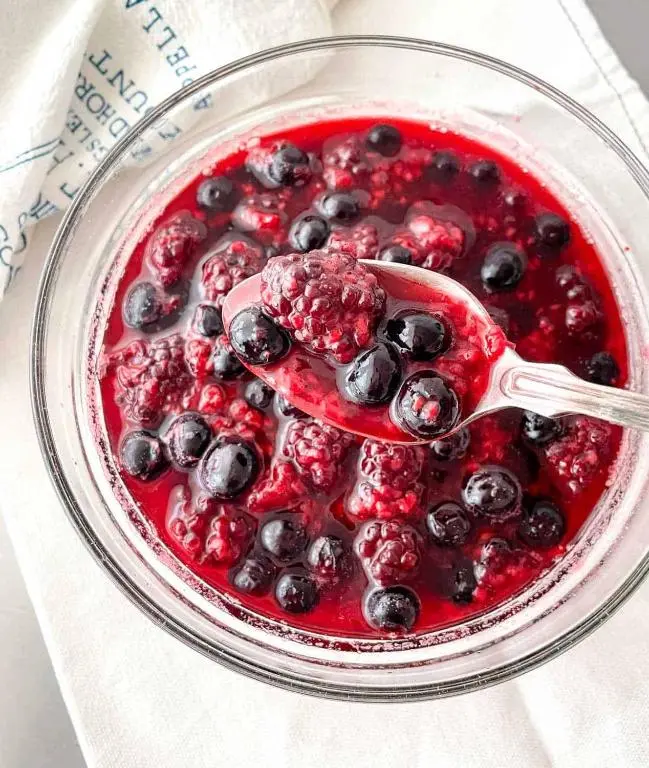 a bowl of blueberry sauce with a spoon in it at Waterside House B&B in Ullapool