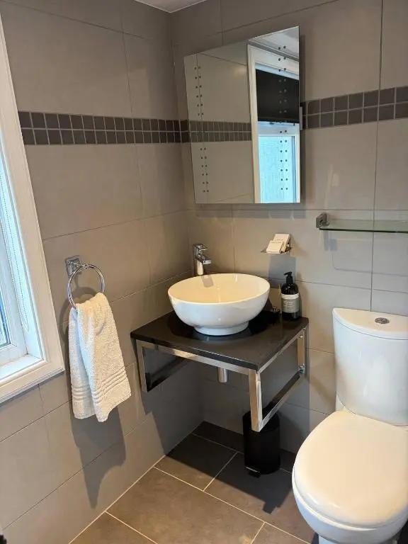 a bathroom with a sink and a toilet at Waterside House B&B in Ullapool