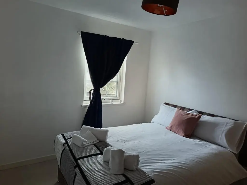 a small bedroom with a bed with a window at 2 Bed, Banchory in Banchory