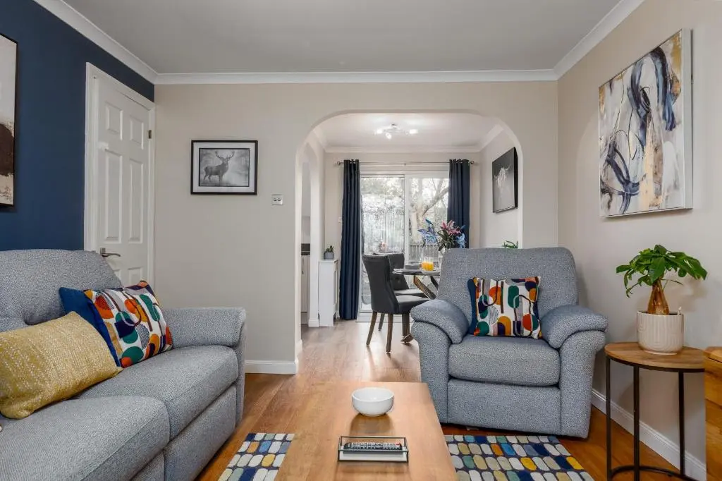 a living room with a couch and two chairs at Castle Heather 2 Bedroom Holiday Home in Inshes