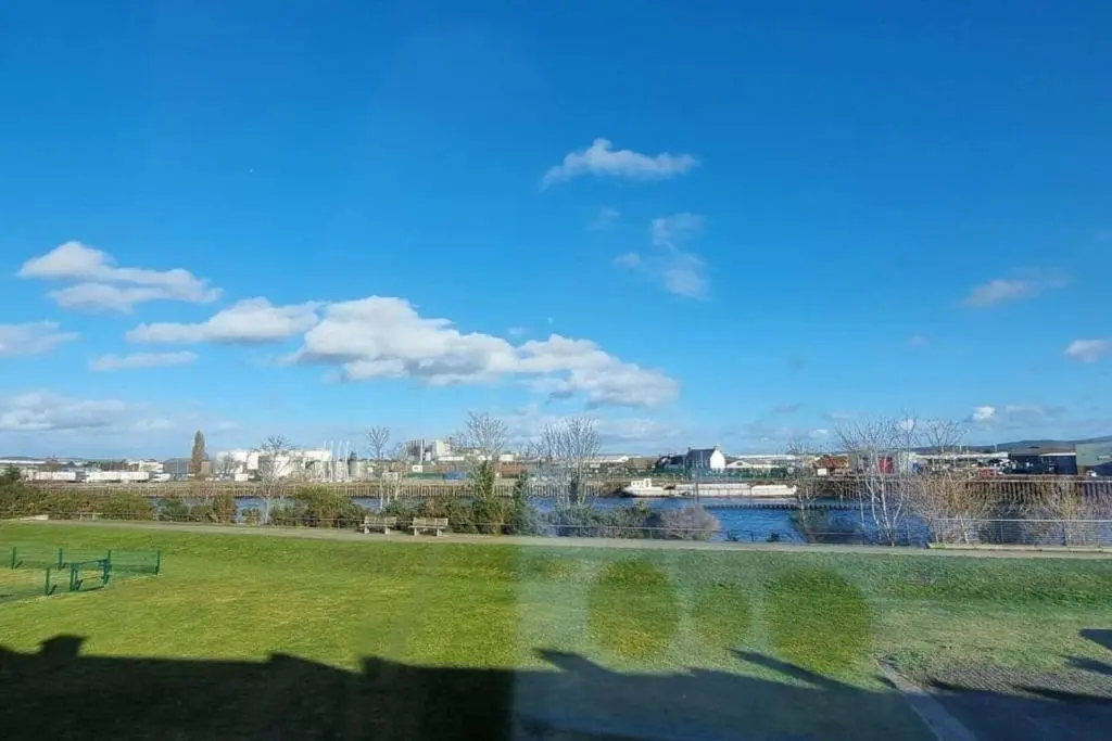 a view of a park with a body of water at Harbour View 45 Anderson Street Inverness IV3 8BU in Inverness