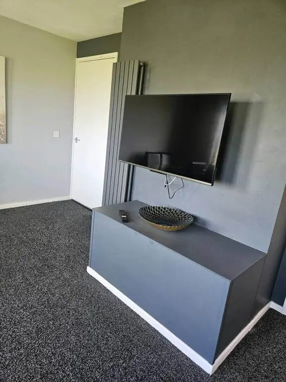 a tv on top of a counter in a room at Harbour View 45 Anderson Street Inverness IV3 8BU in Inverness