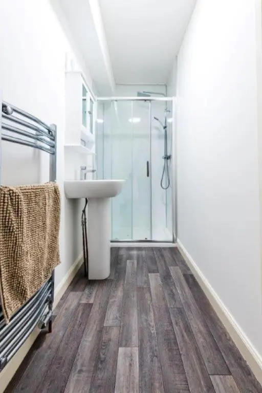 a bathroom with a sink and a shower at Josies House in Banff