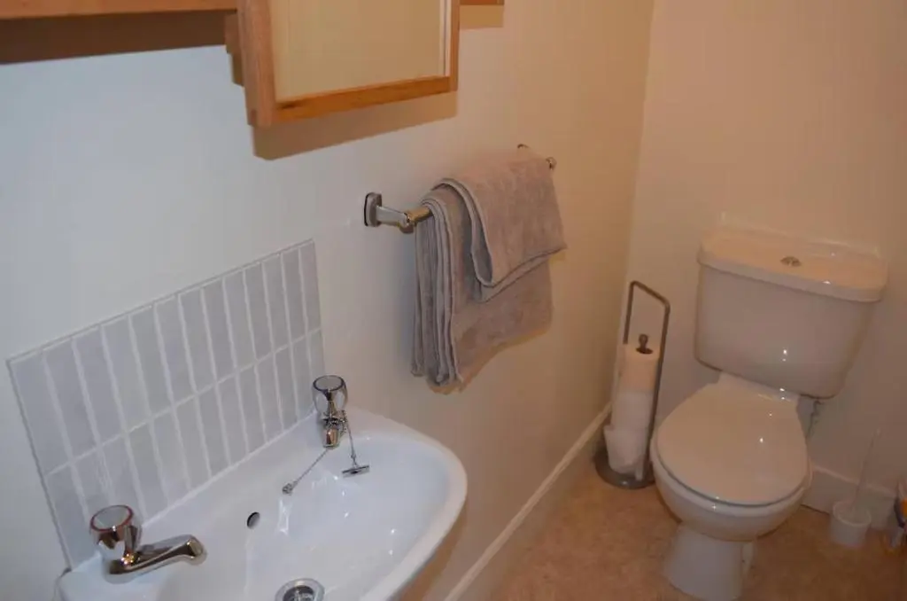 a bathroom with a toilet and a tub and a sink at Bankside - 1 En-Suite in Central - Free Parking in Wick