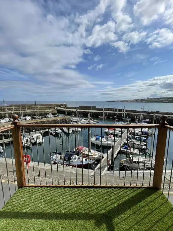 a view of a marina with boats in the water at Apartment in Banff in Banff