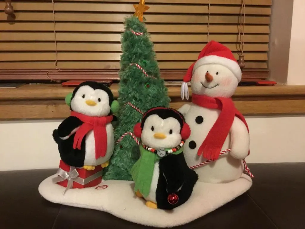 three penguins and a christmas tree on a table at Dullatur in Newtonmore