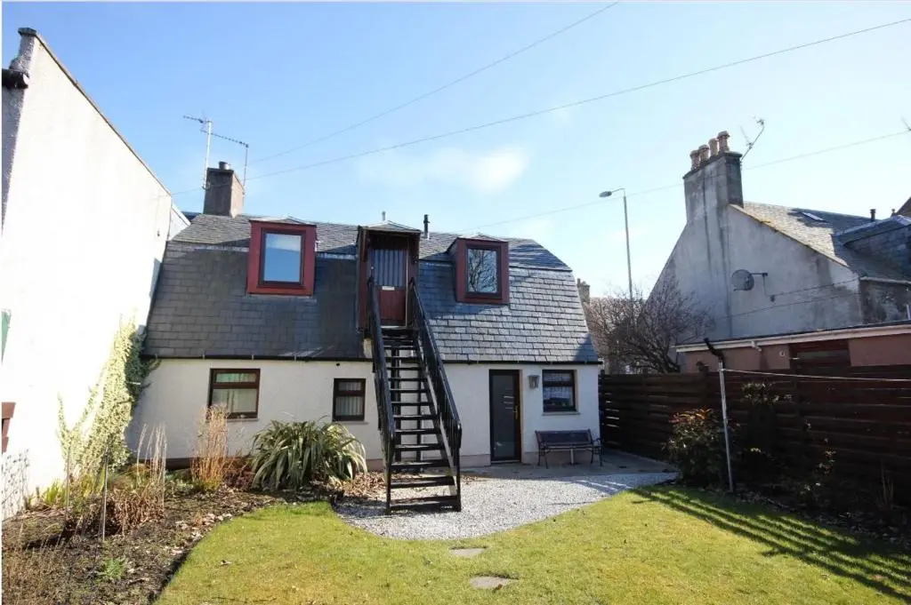 a house with a ladder in front of it at The Loft, Inverness in Inverness