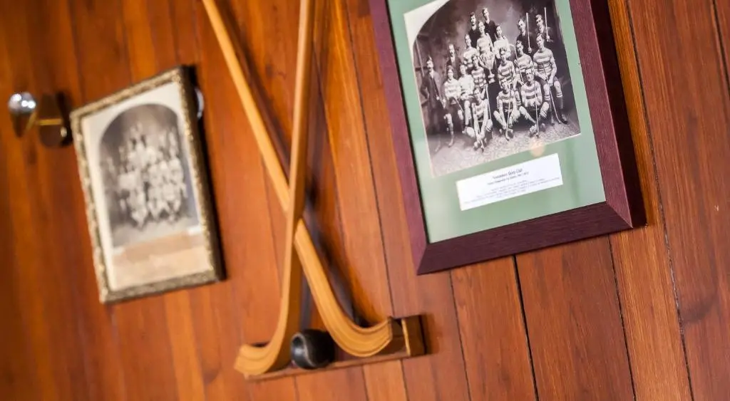 a picture of a hockey team hanging on a door at The Balavil Hotel Newtonmore - Restaurant, Bars & Swimming Pool in Newtonmore