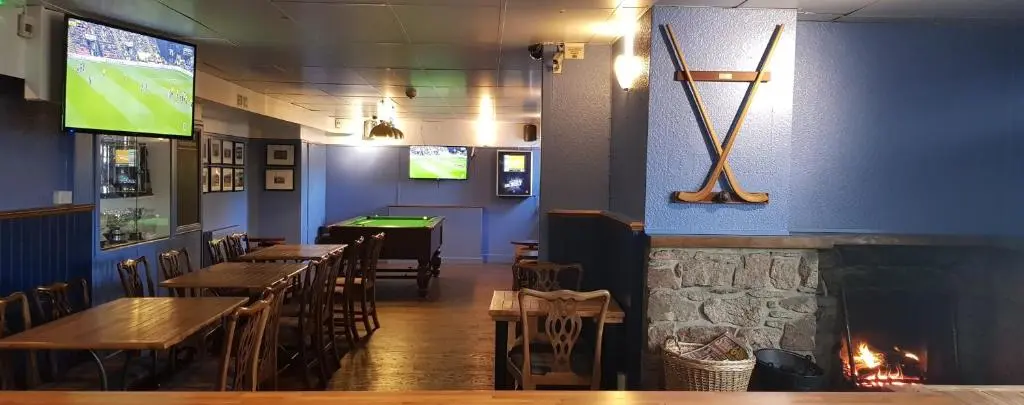 a dining room with tables and a pool table at The Balavil Hotel Newtonmore - Restaurant, Bars & Swimming Pool in Newtonmore