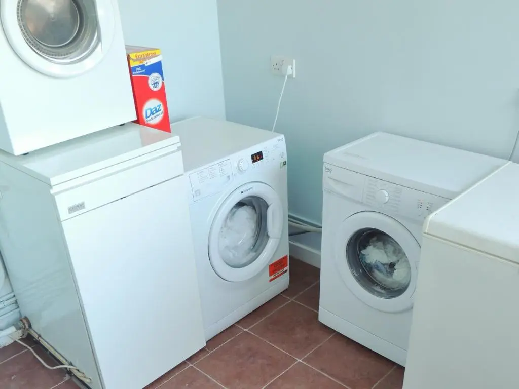 two washing machines and a washer and dryer at Invicta House B&B in Golspie