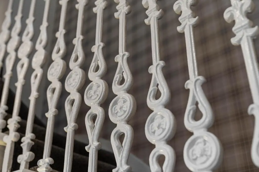 a bunch of white metal railings on a staircase at mySTAYINN Strathblane House in Inverness