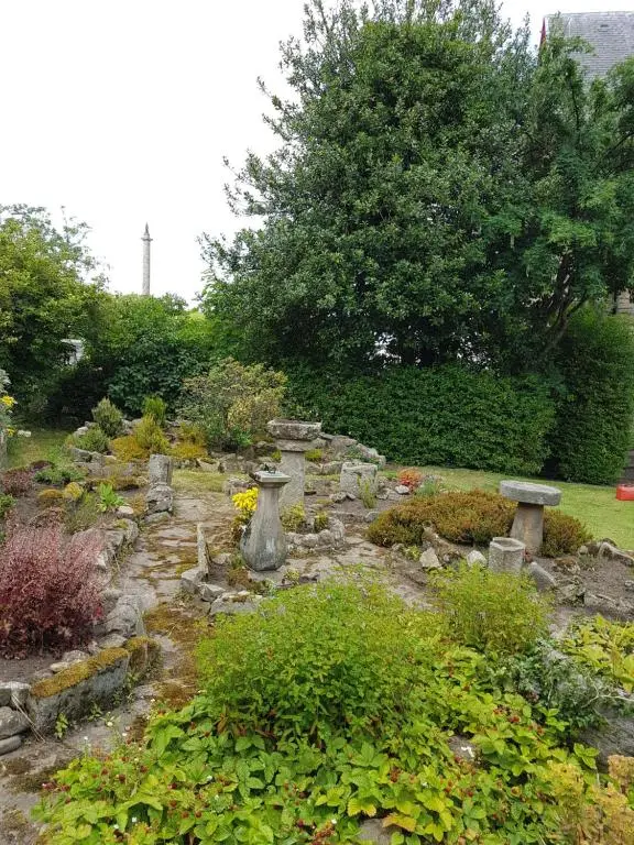 a garden with a bunch of rocks and plants at St Michaels Guest House in Elgin