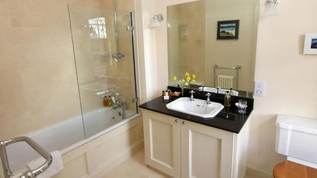 a bathroom with a sink and a shower at Dalvey House in Forres