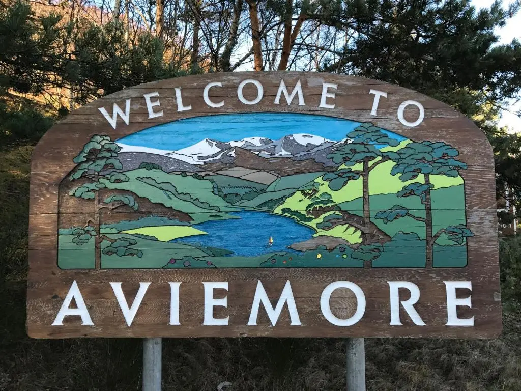 a welcome sign for a welcome to awenome at Riverbank Lodge in Aviemore