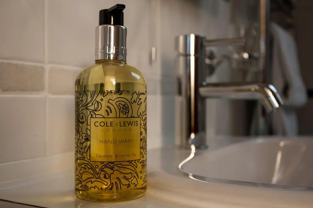 a bottle of olive liquids sitting on a counter at Dunhallin House in Inverness
