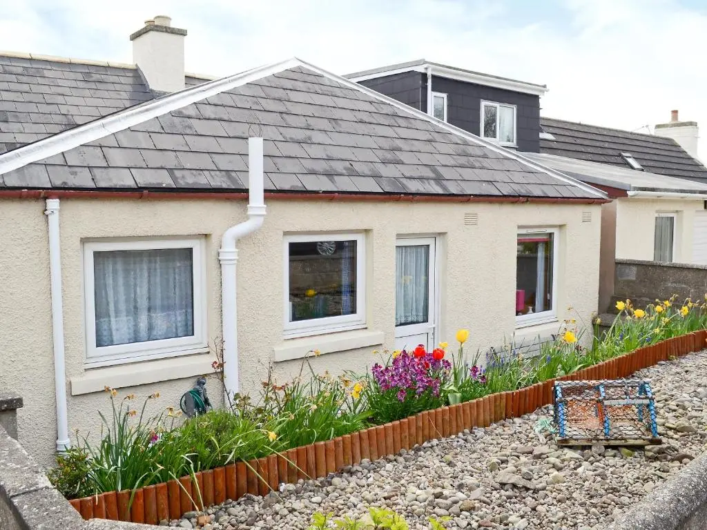 a house with a garden in front of it at Cross Tides in Hilton of Cadboll