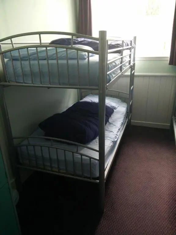 a couple of bunk beds in a room at The Smugglers Hostel in Tomintoul