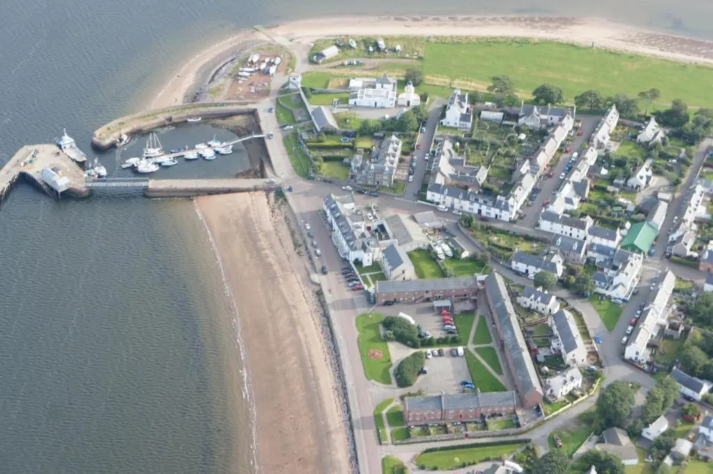 an aerial view of a beach and a harbor at The Royal Hotel Cromarty in Cromarty