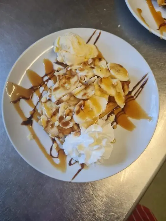 a plate of food with bananas and ice cream at Victoria Hotel in Portknockie