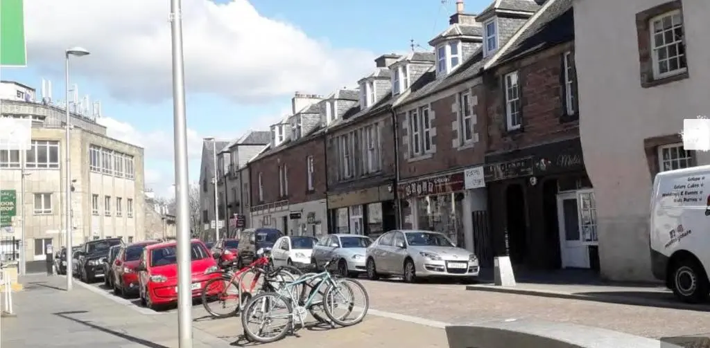 a group of bikes parked on a city street at City Centre Cottage in Inverness