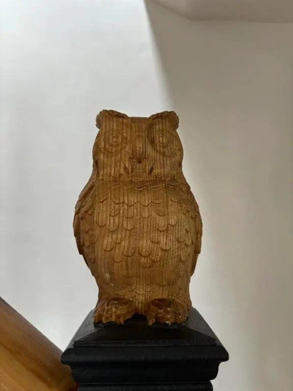 a statue of an owl sitting on top of a table at Crannach House bed and breakfast and self catering apartments in Ballater